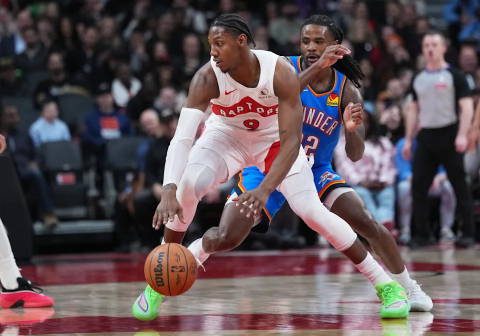Feb 24, 2026; Toronto, Ontario, CAN; Toronto Raptors forward RJ Barrett (9) dribbles against Oklahoma City Thunder guard Cason Wallace (22) during the fourth quarter at Scotiabank Arena. Mandatory Credit: Nick Turchiaro-Imagn Images