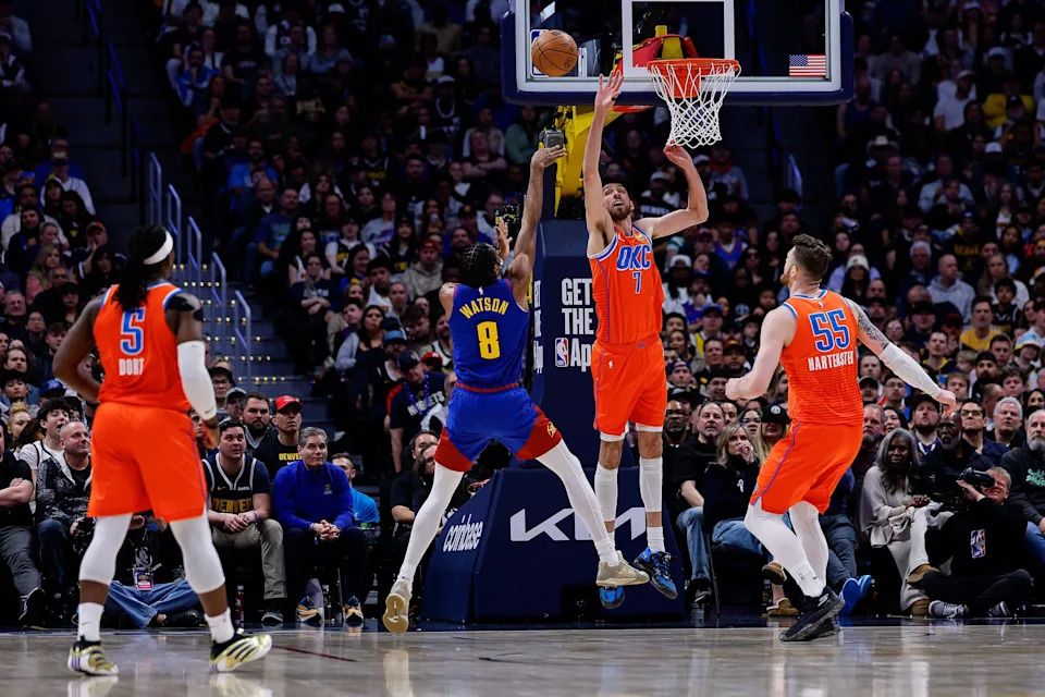 Feb 1, 2026; Denver, Colorado, USA; Denver Nuggets guard Peyton Watson (8) attempts a shot against Oklahoma City Thunder center Chet Holmgren (7) as center Isaiah Hartenstein (55) defends in the second quarter at Ball Arena. Mandatory Credit: Isaiah J. Downing-Imagn Images
