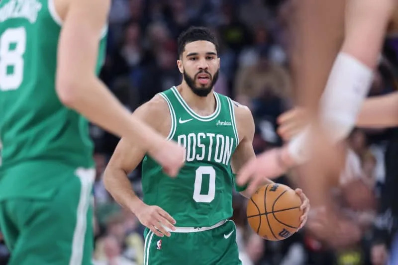 Mar 21, 2025; Salt Lake City, Utah, USA; Boston Celtics forward Jayson Tatum (0) brings the ball up the court against the Utah Jazz during the first half at Delta Center. Mandatory Credit: Rob Gray-Imagn Images