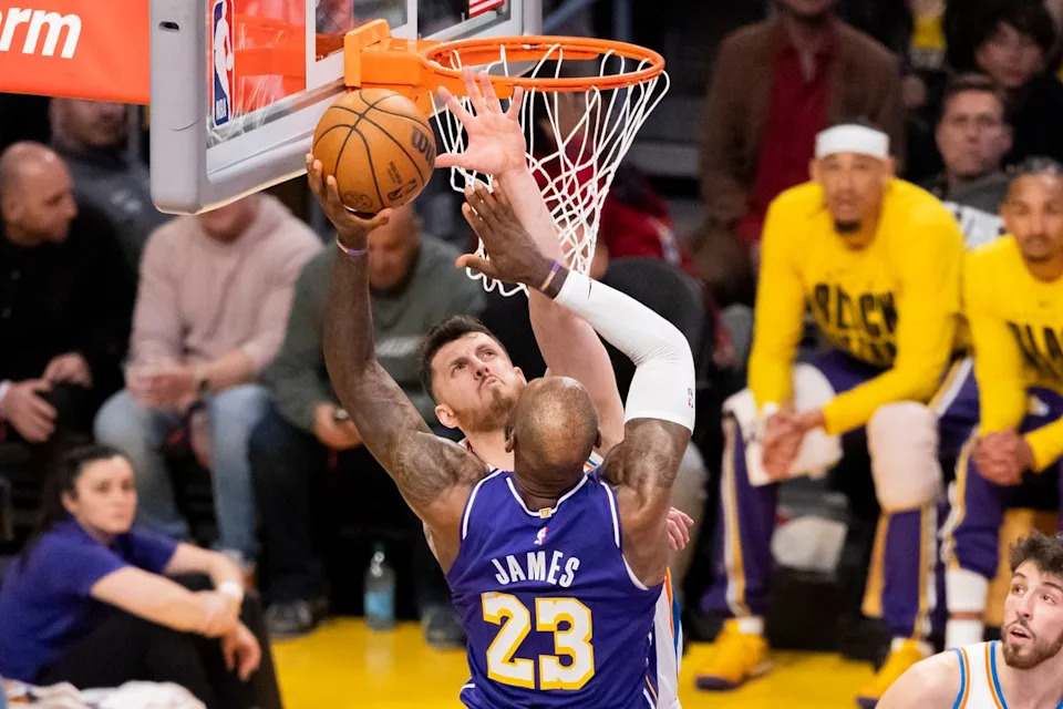 LeBron James #23 of the Los Angeles Lakers drives towards the rim against Isaiah Hartenstein #55 of the Oklahoma City Thunder during an NBA basketball game, Monday February 9, 2026 in Los Angeles, Calif.