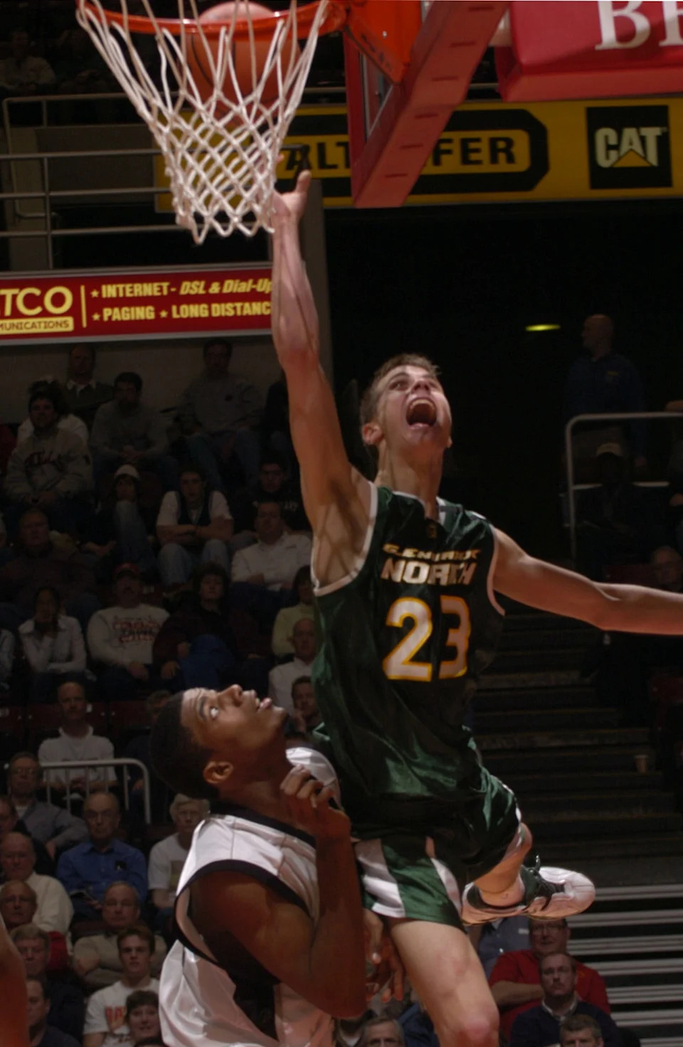 Former Northbrook Glenbrook North player Jon Scheyer moves around Michael DeWalt of Carbondale in the 2005 Class AA state title game at Carver Arena in Peoria.