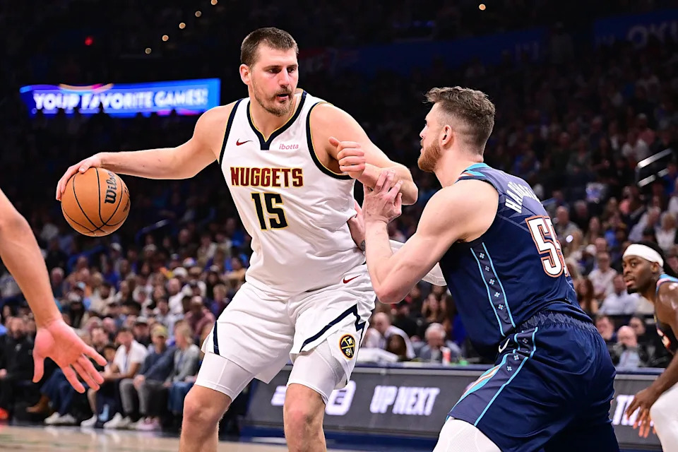 OKLAHOMA CITY, OKLAHOMA - FEBRUARY 27: Nikola Jokic #15 of the Denver Nuggets handles the ball while being defended by Isaiah Hartenstein #55 of the Oklahoma City Thunder during the first half at Paycom Center on February 27, 2026 in Oklahoma City, Oklahoma. NOTE TO USER: User expressly acknowledges and agrees that, by downloading and or using this photograph, User is consenting to the terms and conditions of the Getty Images License Agreement. (Photo by Joshua Gateley/Getty Images)