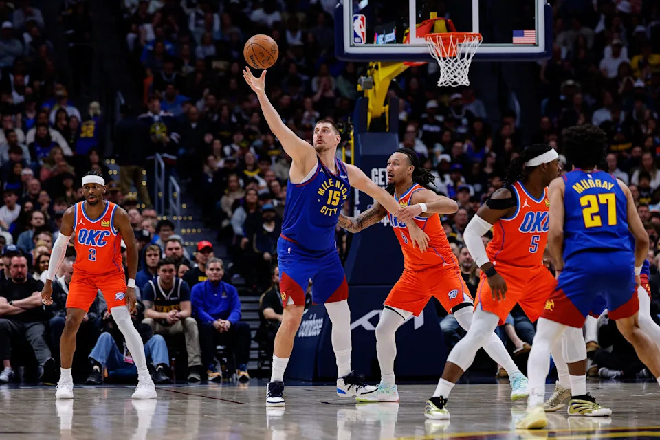 Feb 1, 2026; Denver, Colorado, USA; Denver Nuggets center Nikola Jokic (15) grabs a pass as Oklahoma City Thunder forward Jaylin Williams (6) guards in the second quarter at Ball Arena. Mandatory Credit: Isaiah J. Downing-Imagn Images