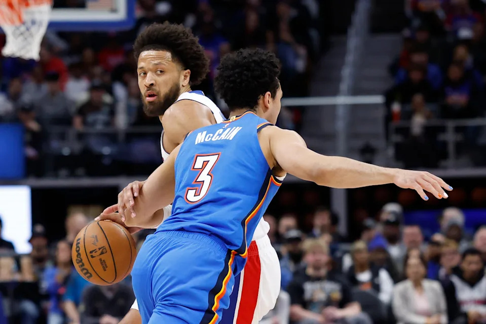 Feb 25, 2026; Detroit, Michigan, USA; Detroit Pistons center Isaac Jones (3) dribbles defended by Oklahoma City Thunder guard Jared McCain (3) in the first half at Little Caesars Arena. Mandatory Credit: Rick Osentoski-Imagn Images