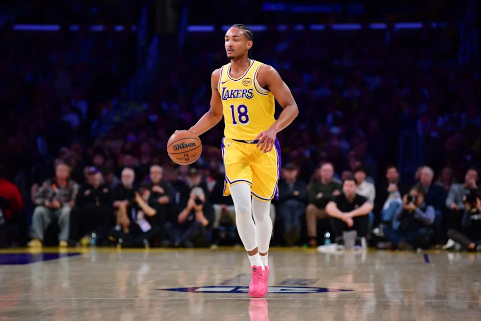 Feb 10, 2026; Los Angeles, California, USA; Los Angeles Lakers guard Kobe Bufkin (18) controls the ball against the San Antonio Spurs during the first half at Crypto.com Arena. Mandatory Credit: Gary A. Vasquez-Imagn Images