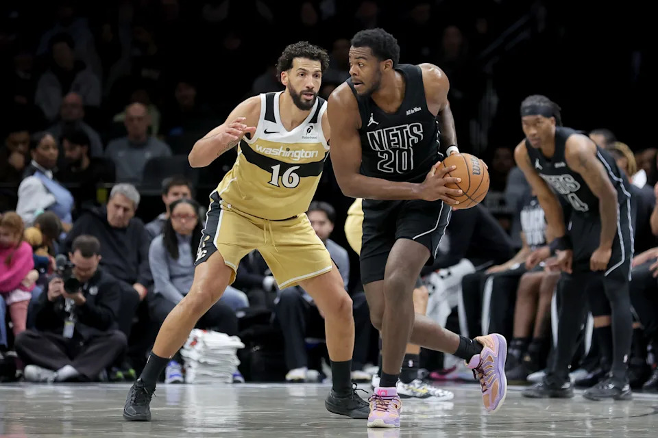 Feb 7, 2026; Brooklyn, New York, USA; Brooklyn Nets center Day'ron Sharpe (20) controls the ball against Washington Wizards forward Anthony Gill (16) during the second quarter at Barclays Center. Mandatory Credit: Brad Penner-Imagn Images