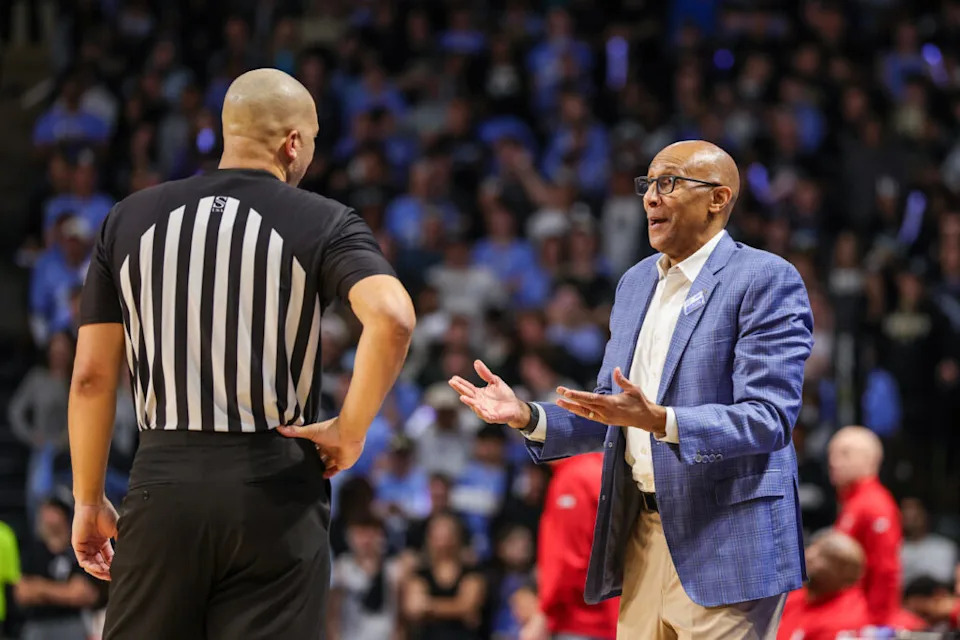 Jan 31, 2026; Orlando, Florida, USA; UCF Knights head coach Johnny Dawkins speaks with an official during the first half against the Texas Tech Red Raiders at Addition Financial Arena. Mandatory Credit: Mike Watters-Imagn Images