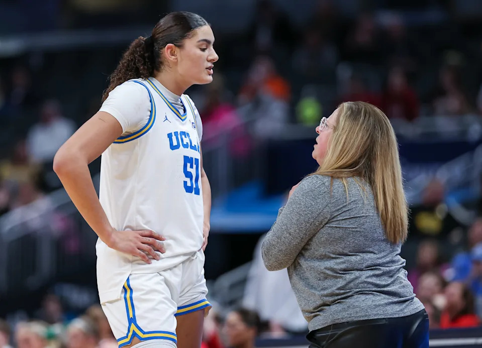 INDIANAPOLIS, INDIANA - MARCH 7: Lauren Betts #51 s talks with head coach Cori Close of the UCLA Bruins during the game against the Nebraska Cornhuskers in the Big Ten Women's Basketball Tournament quarterfinals at Gainbridge Fieldhouse on March 7, 2025 in Indianapolis, Indiana.  (Photo by Michael Hickey/Getty Images)