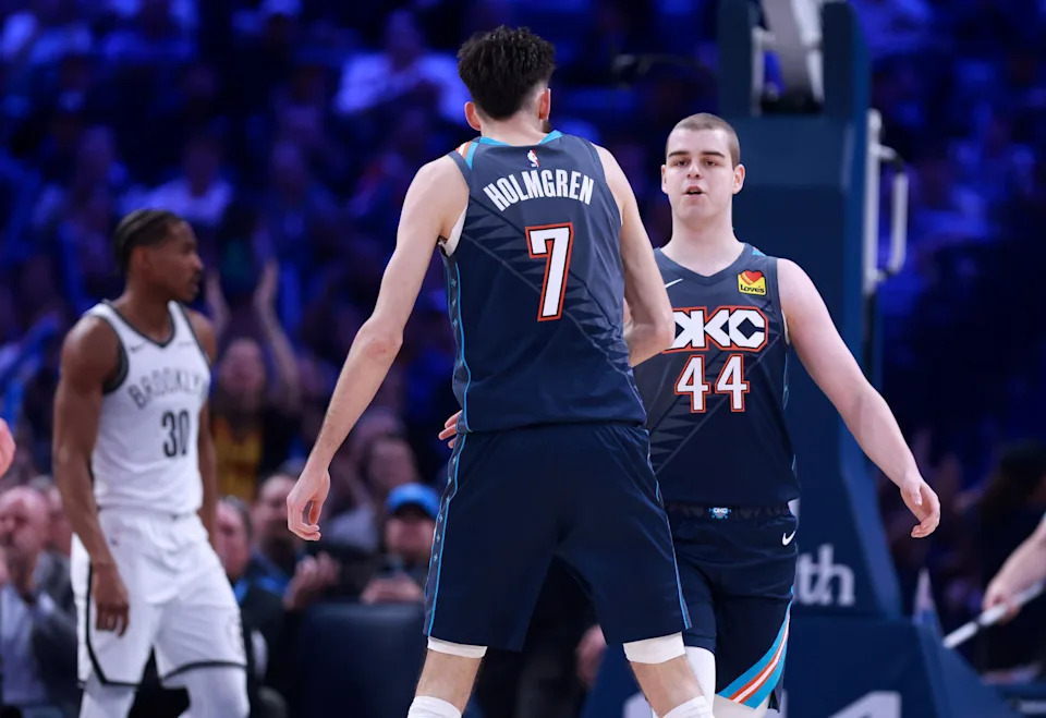 Oklahoma City guard Nikola Topic (44) celebrates with Chet Holmgren (7) during the NBA basketball game between the Oklahoma City Thunder and the Brooklyn Nets at Paycom Center in Oklahoma City, Friday Feb. 20, 2026.