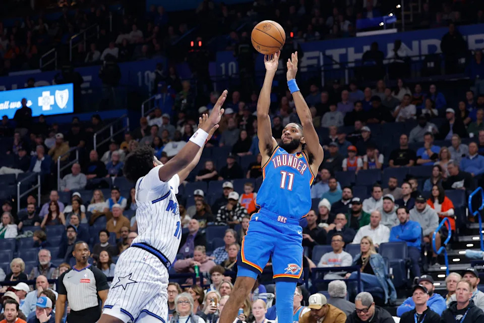 Feb 3, 2026; Oklahoma City, Oklahoma, USA; Oklahoma City Thunder guard Isaiah Joe (11) shoots against the Orlando Magic during the second half at Paycom Center. Mandatory Credit: Alonzo Adams-Imagn Images