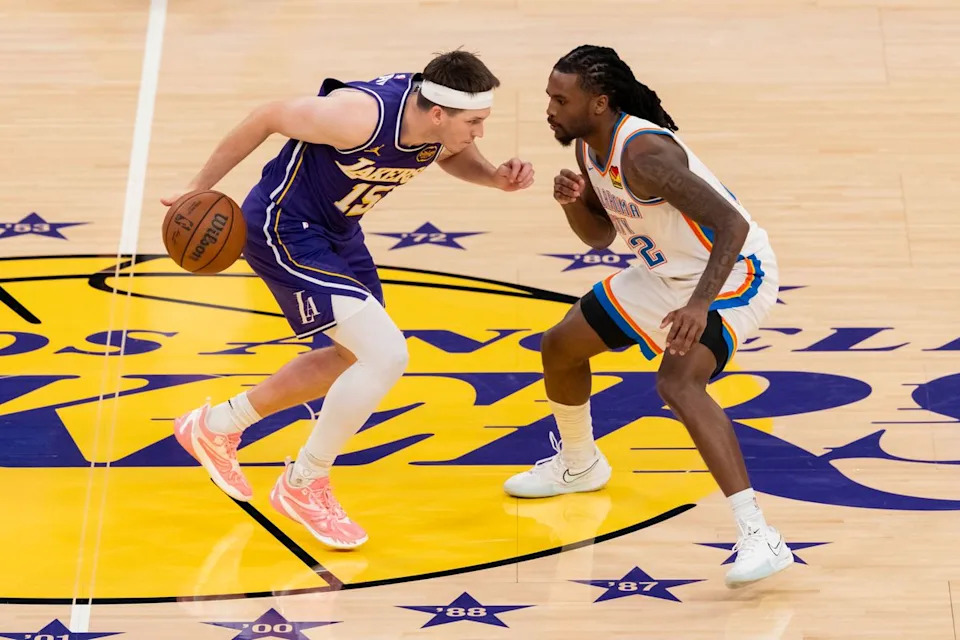 Austin Reaves #15 of the Los Angeles Lakers handles the ball against Cason Wallace #22 of the Oklahoma City Thunder during an NBA basketball game, Monday February 9, 2026 in Los Angeles, Calif.