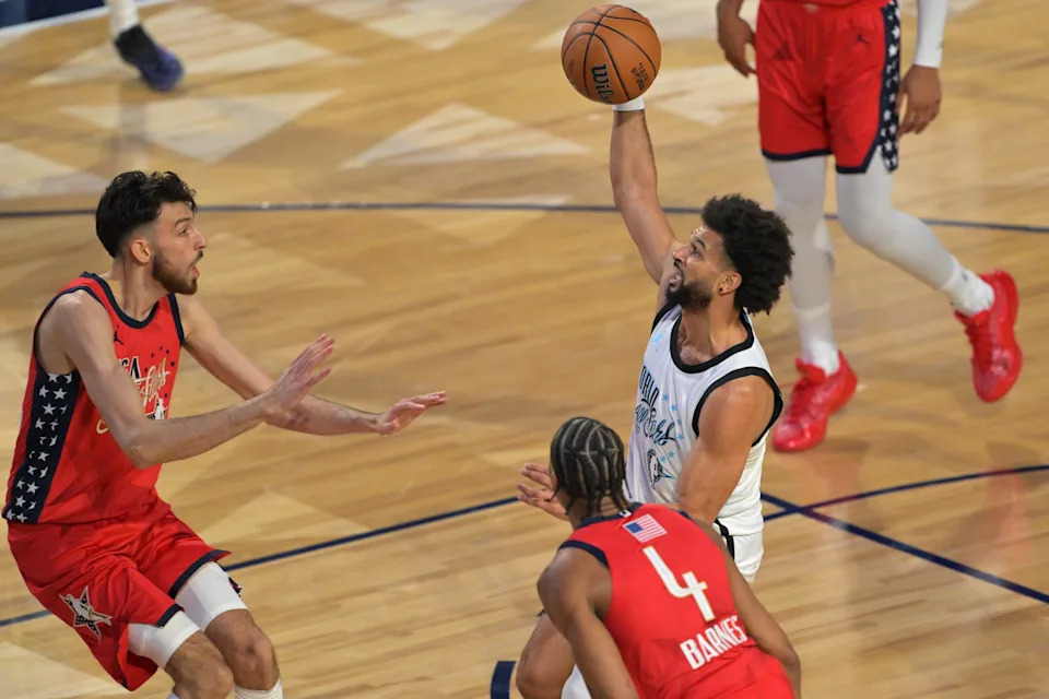 Feb 15, 2026; Inglewood, California, USA; Team World guard Jamal Murray (27) of the Denver Nuggets controls the ball against Team USA Stars forward Scottie Barnes (4) of the Toronto Raptors and Chet Holmgren (7) of the Oklahoma City Thunder n game one during the 75th NBA All Star Game at Intuit Dome. Mandatory Credit: Jayne Kamin-Oncea-Imagn Images
