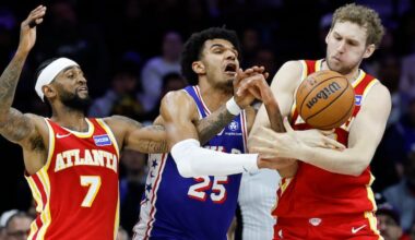Sixers forward Dominick Barlow (center) goes and Atlanta Hawks center Jock Landale (right) battle for the basketball during the third quarter on Thursday night.