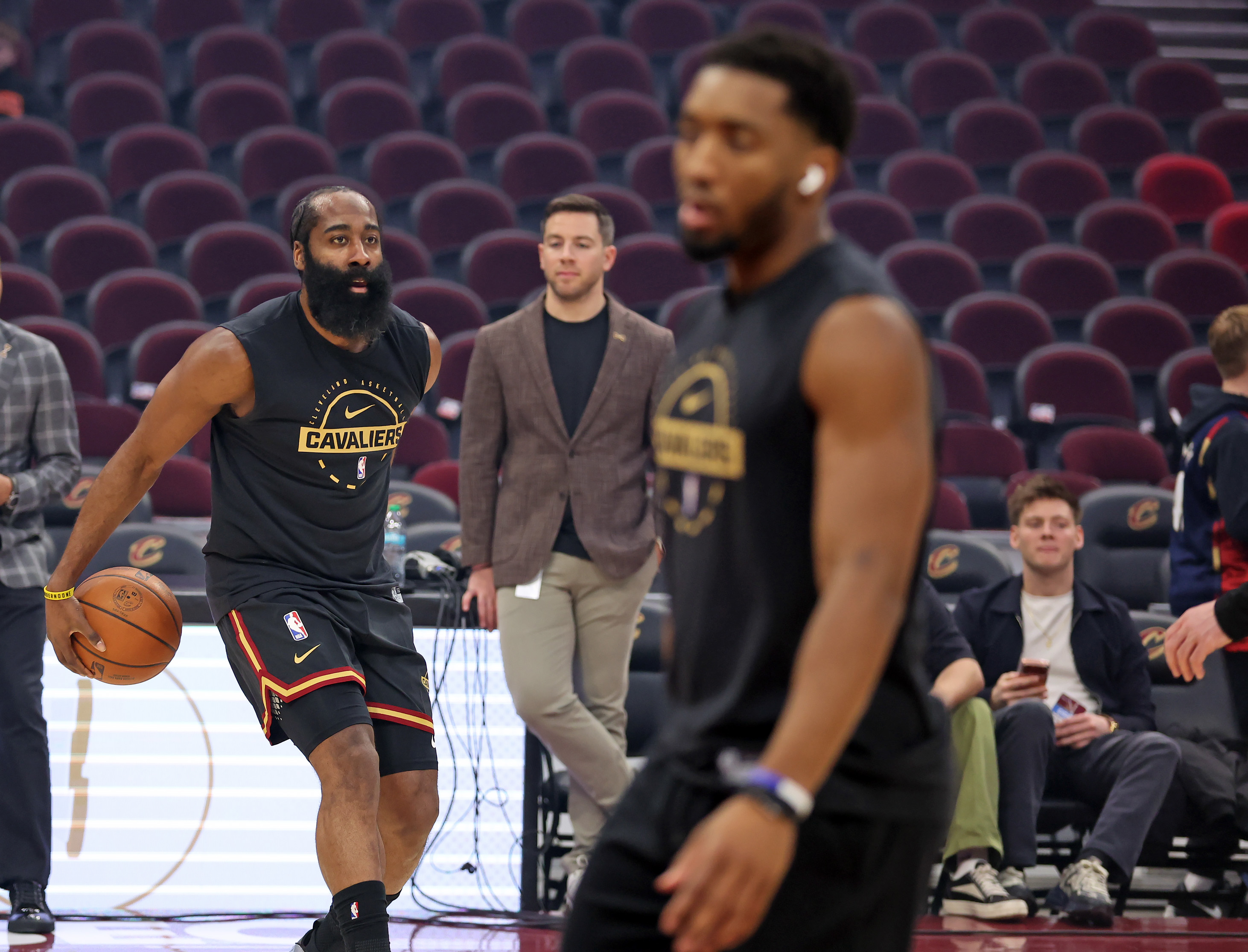 Cleveland Cavaliers guard James Harden and Cleveland Cavaliers guard Donovan Mitchell warm up before the game against the Washington Wizards. 