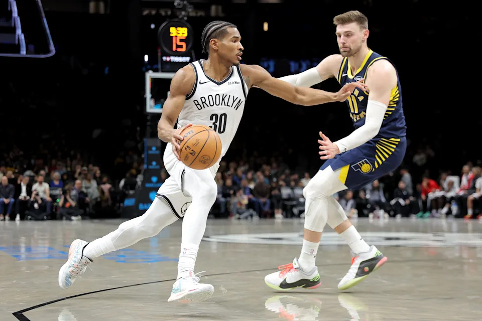 Feb 11, 2026; Brooklyn, New York, USA; Brooklyn Nets guard Ochai Agbaji (30) drives to the basket against Indiana Pacers center Micah Potter (11) during the second quarter at Barclays Center. Mandatory Credit: Brad Penner-Imagn Images
