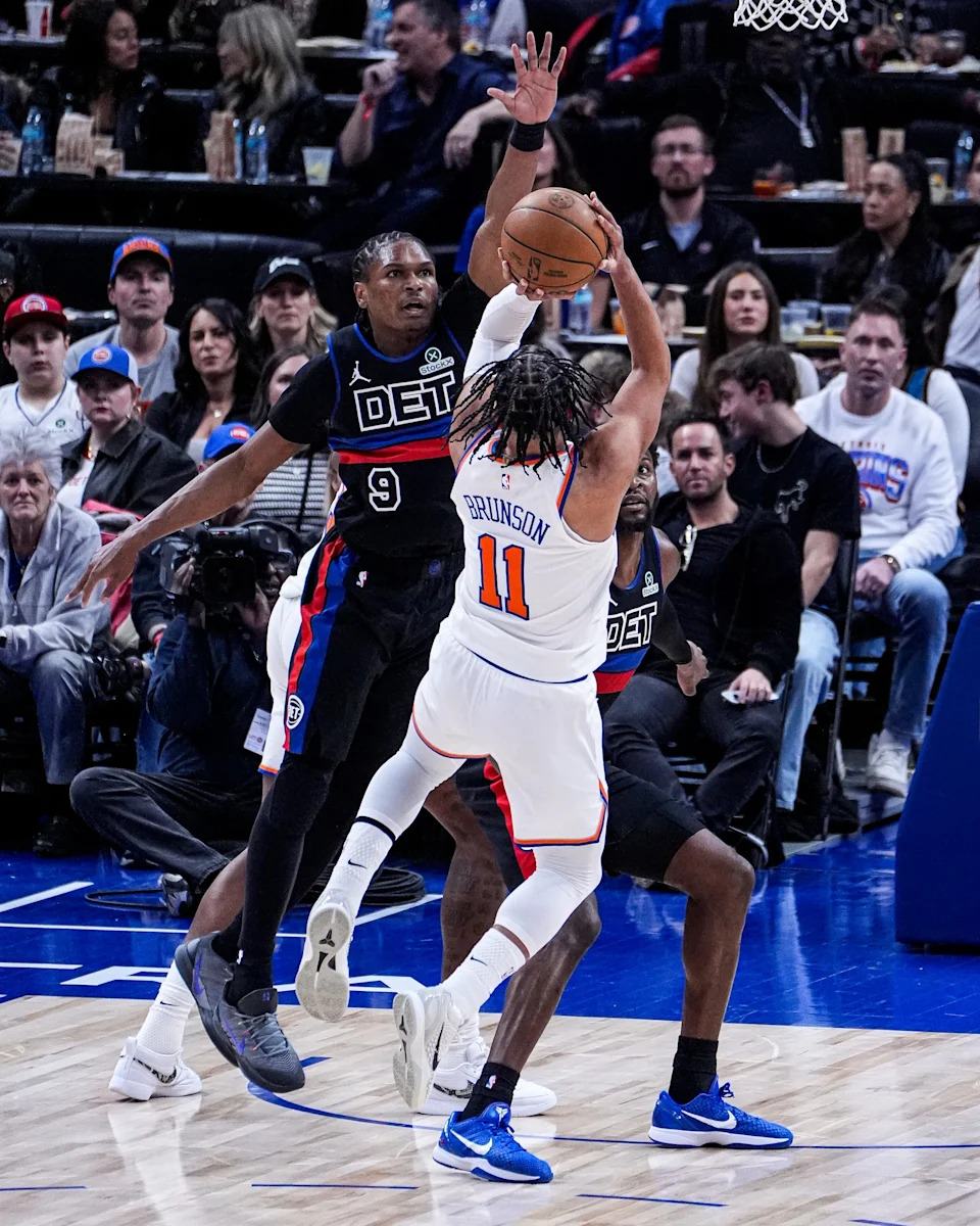 Detroit Pistons guard Ausar Thompson (9) defends New York Knicks guard Jalen Brunson (11) during the first half at Little Caesars Arena in Detroit on Friday, February 6, 2026.