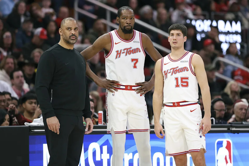 Jan 31, 2026; Houston, Texas, USA; Houston Rockets head coach Ime Udoka and forward Kevin Durant (7) and guard Reed Sheppard (15) look on during a play during the first quarter against the Dallas Mavericks at Toyota Center. Mandatory Credit: Troy Taormina-Imagn Images