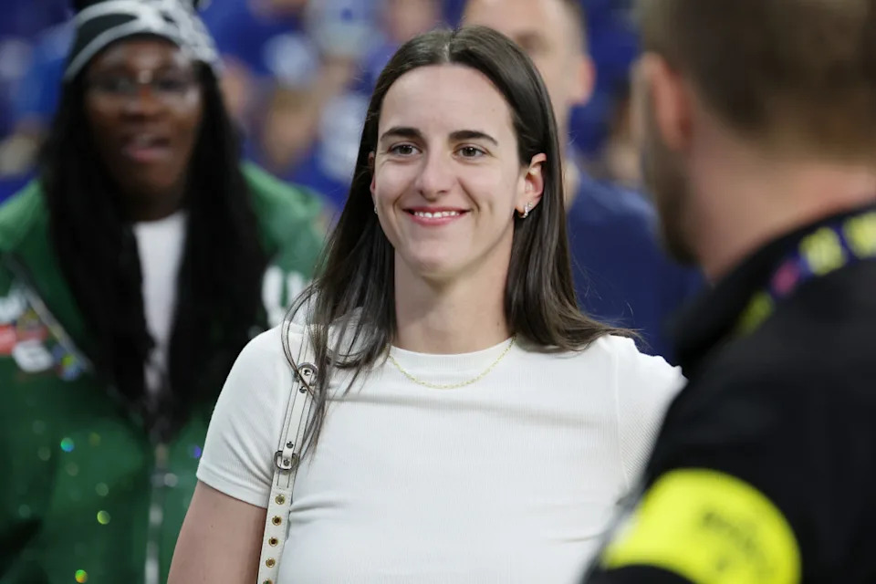 Indiana Fever guard Caitlin Clark looks on from the sideline before NFL game between the Las Vegas Raiders and the Indianapolis Colts.© Trevor Ruszkowski-Imagn Images