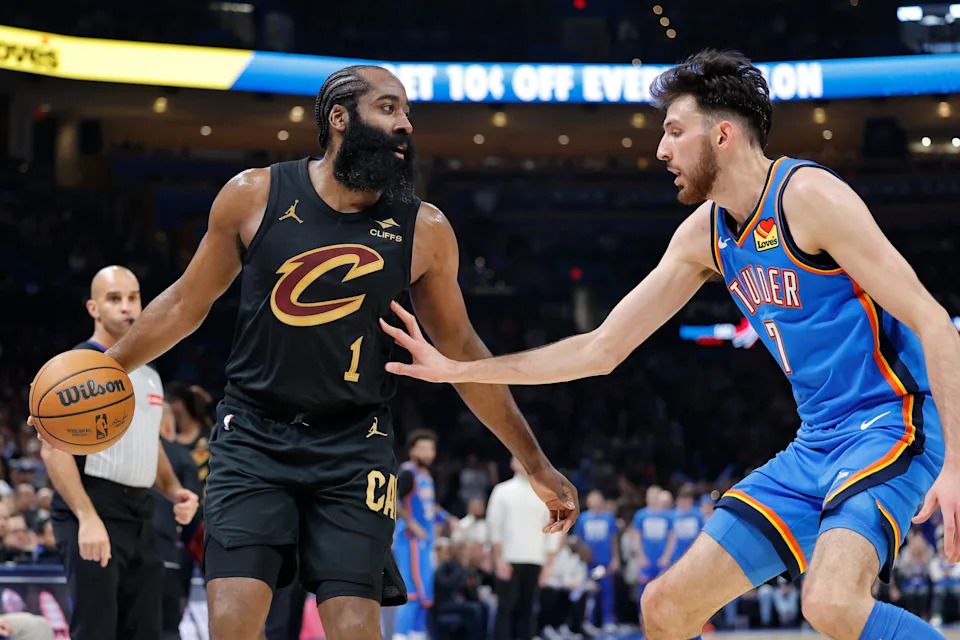 Feb 22, 2026; Oklahoma City, Oklahoma, USA; Cleveland Cavaliers guard James Harden (1) moves the ball as Oklahoma City Thunder center/forward Chet Holmgren (7) defends during the second half at Paycom Center. Mandatory Credit: Alonzo Adams-Imagn Images