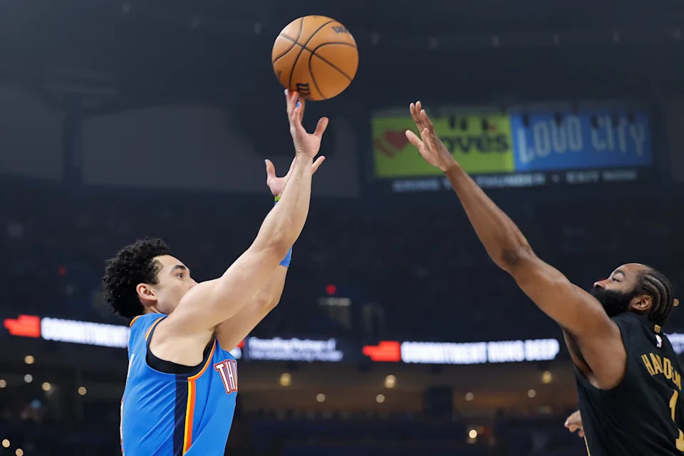 Feb 22, 2026; Oklahoma City, Oklahoma, USA; Oklahoma City Thunder guard Jared McCain (3) shoots a three point basket as Cleveland Cavaliers guard James Harden (1) defends during the first half at Paycom Center. Mandatory Credit: Alonzo Adams-Imagn Images