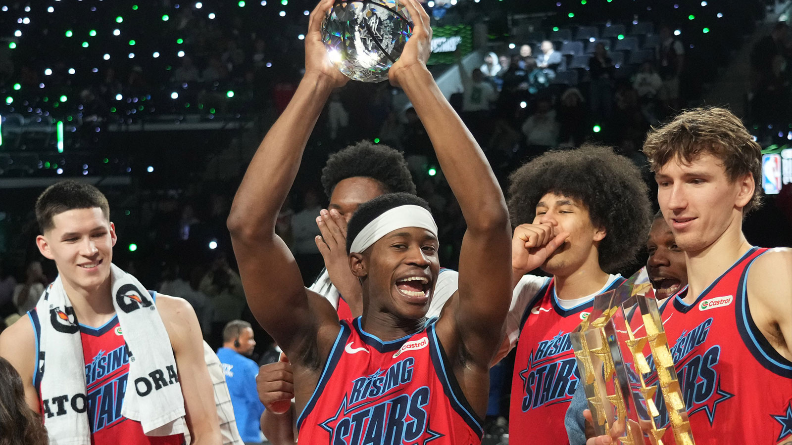 Team Vince guard VJ Edgecombe (77) of the Philadelphia 76ers reacts with the MVP trophy after defeating Team Melo during an NBA All Star Rising Stars championship game at Intuit Dome.