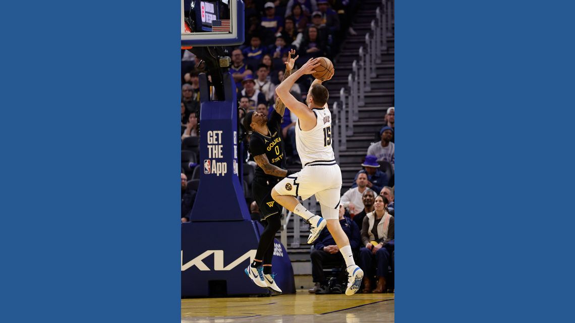 Podziemski scores 12 late as Warriors beat Nuggets 128-117 despite Jokic triple-double