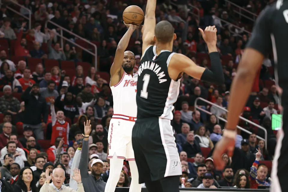 Jan 28, 2026; Houston, Texas, USA; Houston Rockets forward Kevin Durant (7) shoots the ball as San Antonio Spurs forward Victor Wembanyama (1) defends during the first quarter at Toyota Center. Mandatory Credit: Troy Taormina-Imagn Images