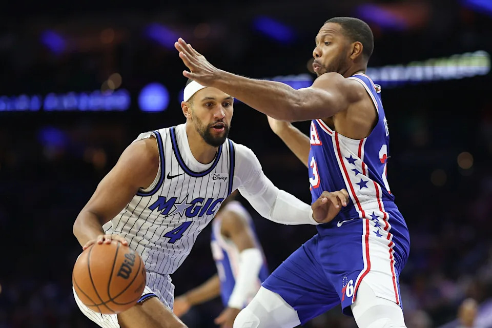 Oct 27, 2025; Philadelphia, Pennsylvania, USA; Orlando Magic guard Jalen Suggs (4) drives against Philadelphia 76ers guard Eric Gordon (23) during the second quarter at Xfinity Mobile Arena. Mandatory Credit: Bill Streicher-Imagn Images