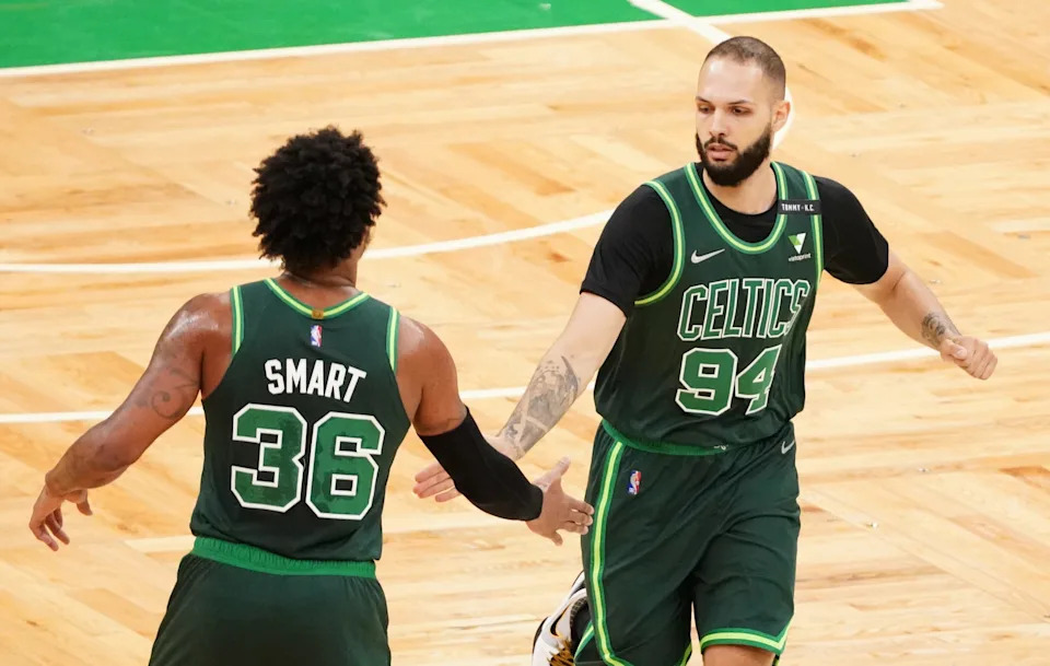 Mar 31, 2021; Boston, Massachusetts, USA; Boston Celtics guard Evan Fournier (94) reacts with guard Marcus Smart (36) after a play against the Dallas Mavericks during the first quarter at TD Garden. Mandatory Credit: David Butler II-USA TODAY Sports