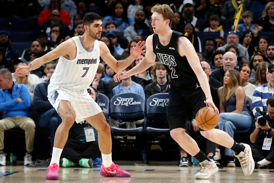 Jan 11, 2026; Memphis, Tennessee, USA; Brooklyn Nets forward Danny Wolf (2) dribbles as Memphis Grizzlies forward Santi Aldama (7) defends during the second quarter at FedExForum. Mandatory Credit: Petre Thomas-Imagn Images