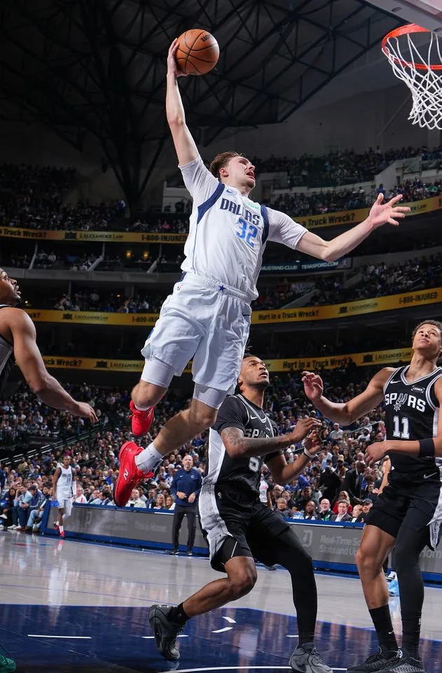 Cooper Flagg dunks the ball during the game against the San Antonio Spurs on Feb. 5, 2026 at American Airlines Center in Dallas. Garrett Ellwood/NBAE via Getty