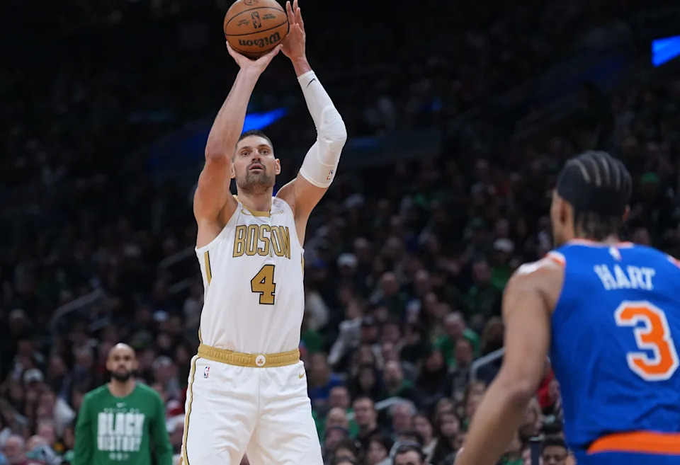 Feb 8, 2026; Boston, Massachusetts, USA; Boston Celtics center Nikola Vucevic (4) shoots the ball against the New York Knicks in the second half at TD Garden. Mandatory Credit: David Butler II-Imagn Images