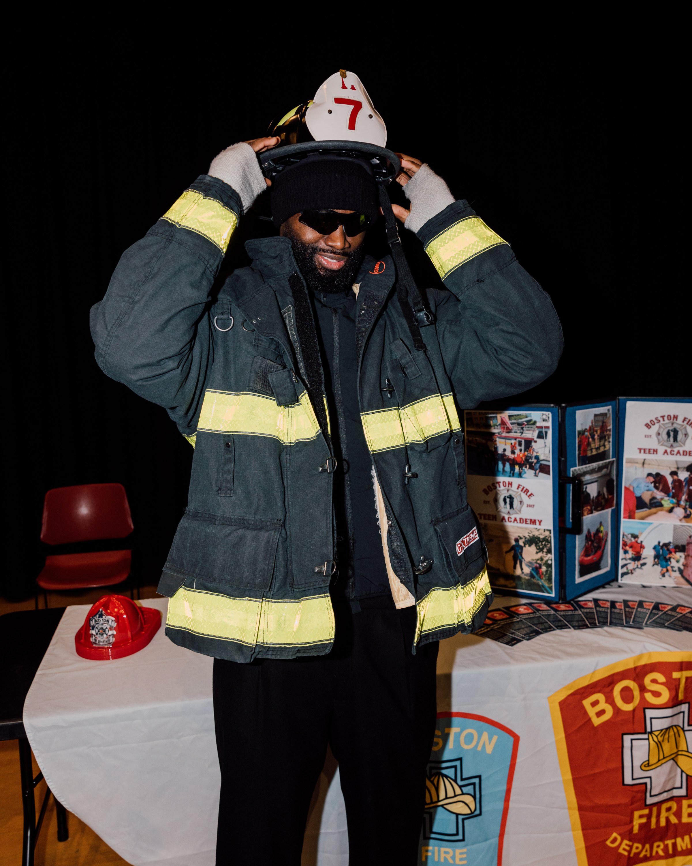 At the 7uice Foundation Educational Fair, Brown tried on a firefighting uniform, and took photos with the Cadets.