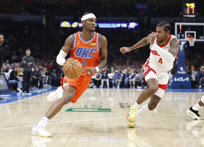 Nov 8, 2024; Oklahoma City, Oklahoma, USA; Oklahoma City Thunder guard Shai Gilgeous-Alexander (2) drives around Houston Rockets guard Jalen Green (4) during the second quarter at Paycom Center. Mandatory Credit: Alonzo Adams-Imagn Images