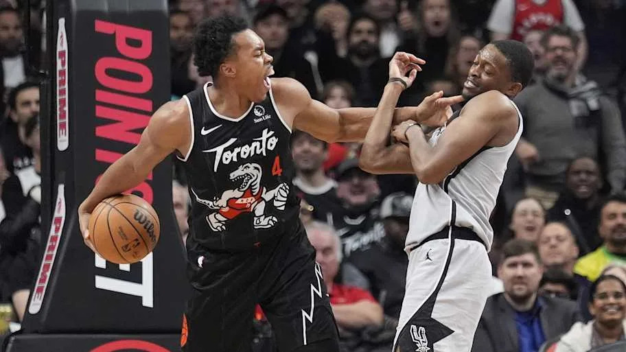 Toronto Raptors guard Scottie Barnes takes the ball away from San Antonio Spurs guard De'Aaron Fox