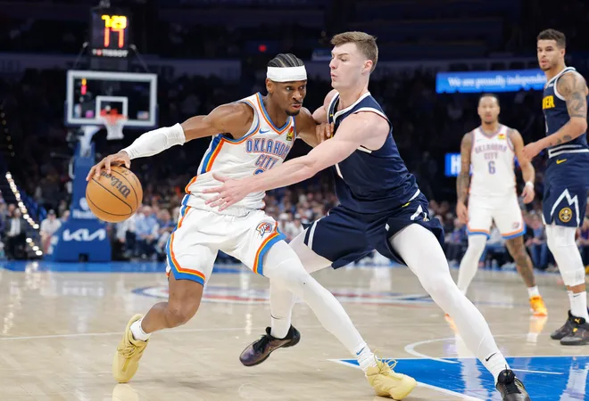 Mar 10, 2025; Oklahoma City, Oklahoma, USA; Oklahoma City Thunder guard Shai Gilgeous-Alexander (2) drives as Denver Nuggets guard Christian Braun (0) defends during the second half at Paycom Center. Mandatory Credit: Alonzo Adams-Imagn Images