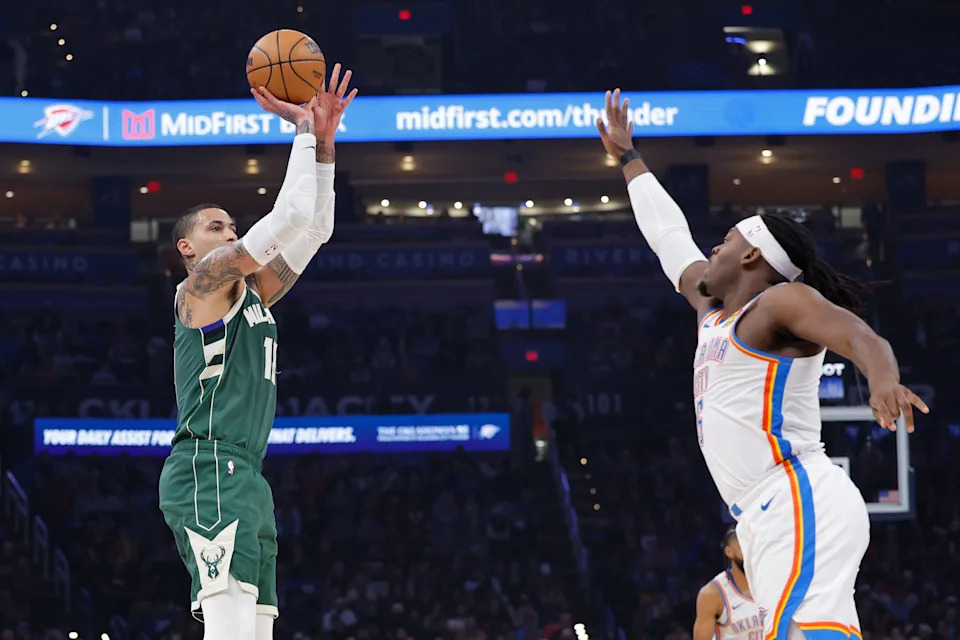 Feb 12, 2026; Oklahoma City, Oklahoma, USA; Milwaukee Bucks forward Kyle Kuzma (18) shoots a three point basket against Oklahoma City Thunder forward Jaylin Williams (6) during the first half at Paycom Center. Mandatory Credit: Alonzo Adams-Imagn Images
