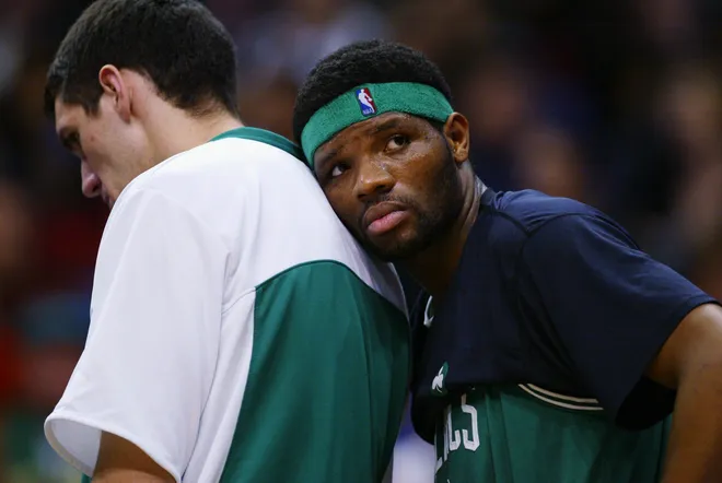 LOS ANGELES - FEBRUARY 15: Walter McCarty #0 of the Boston Celtics leans on teammate Bruno Sundov #41 during the NBA game against the Los Angeles Clippers at Staples Center on February 15, 2003 in Los Angeles, California. The Celtics won 92-84. NOTE TO USER: User expressly acknowledges and agrees that, by downloading and/or using this Photograph, User is consenting to the terms and conditions of the Getty Images License Agreement. (Photo by Lisa Blumenfeld/Getty Images)