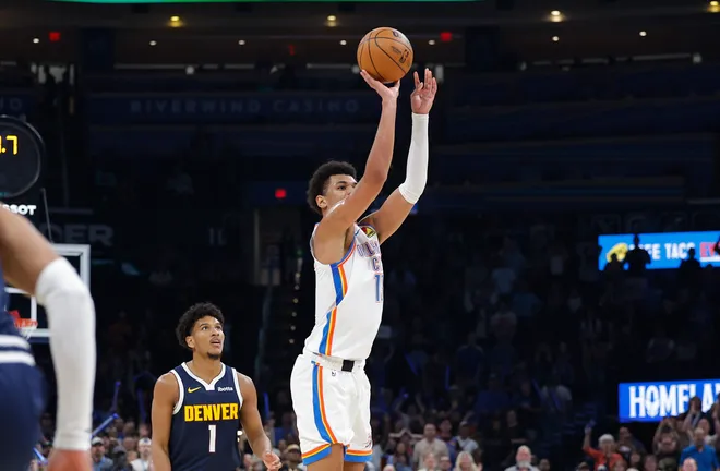 Oct 17, 2025; Oklahoma City, Oklahoma, USA; Oklahoma City Thunder forward Ousmane Dieng (13) shoots a three point basket to win the game against the Denver Nuggets during the second half at Paycom Center. Mandatory Credit: Alonzo Adams-Imagn Images
