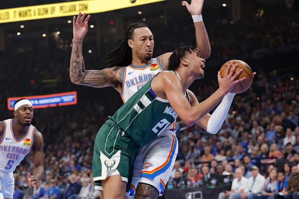 Feb 12, 2026; Oklahoma City, Oklahoma, USA; Milwaukee Bucks forward Ousmane Dieng (21) is defended by Oklahoma City Thunder forward Jaylin Williams (6) on the way to the basket during the first half at Paycom Center. Mandatory Credit: Alonzo Adams-Imagn Images