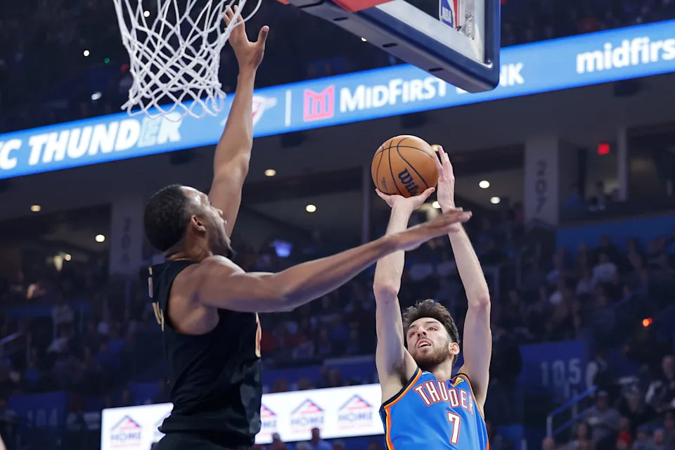 Feb 22, 2026; Oklahoma City, Oklahoma, USA; Oklahoma City Thunder center/forward Chet Holmgren (7) shoots as Cleveland Cavaliers center Evan Mobley (4) defends during the first quarter at Paycom Center. Mandatory Credit: Alonzo Adams-Imagn Images