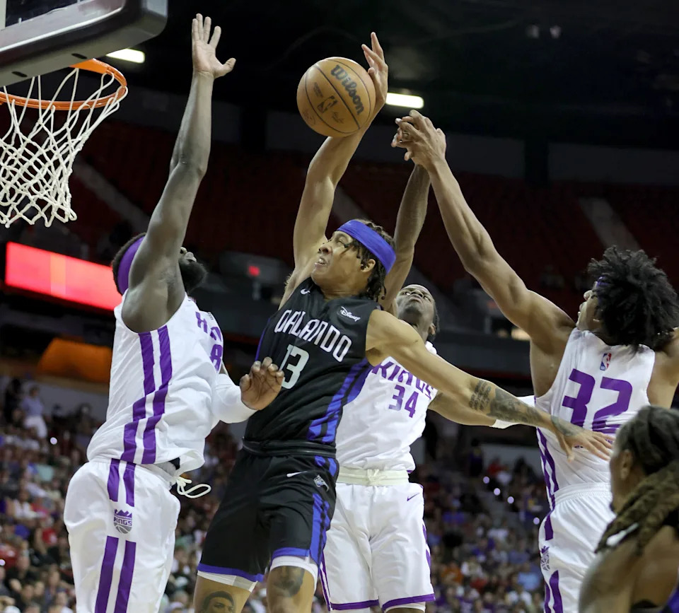 LAS VEGAS, NEVADA - JULY 09: R.J. Hampton #13 of the Orlando Magic drives to the basket against Neemias Queta #88, Keon Ellis #34 and Jared Rhoden #32 of the Sacramento Kings during the 2022 NBA Summer League at the Thomas & Mack Center on July 09, 2022 in Las Vegas, Nevada. NOTE TO USER: User expressly acknowledges and agrees that, by downloading and or using this photograph, User is consenting to the terms and conditions of the Getty Images License Agreement. (Photo by Ethan Miller/Getty Images)