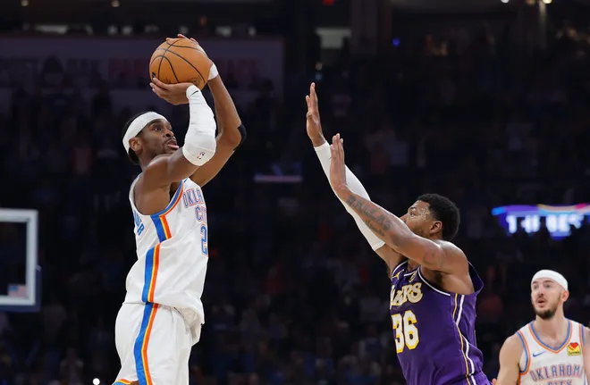 Nov 12, 2025; Oklahoma City, Oklahoma, USA; Oklahoma City Thunder guard Shai Gilgeous-Alexander (2) shoots over Los Angeles Lakers guard Marcus Smart (36) during the second quarter at Paycom Center. Mandatory Credit: Alonzo Adams-Imagn Images