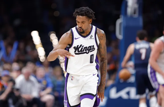 Nov 19, 2025; Oklahoma City, Oklahoma, USA; Sacramento Kings guard Malik Monk (0) gestures after scoring against the Oklahoma City Thunder during the second half at Paycom Center. Mandatory Credit: Alonzo Adams-Imagn Images