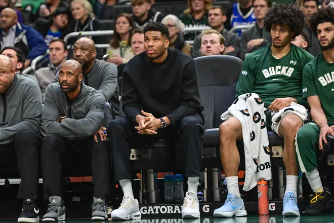 Dec 11, 2025; Milwaukee, Wisconsin, USA; Milwaukee Bucks forward Giannis Antetokounmpo (34) watches the game against the Boston Celtics from the bench in the second quarter at Fiserv Forum. Mandatory Credit: Benny Sieu-Imagn Images