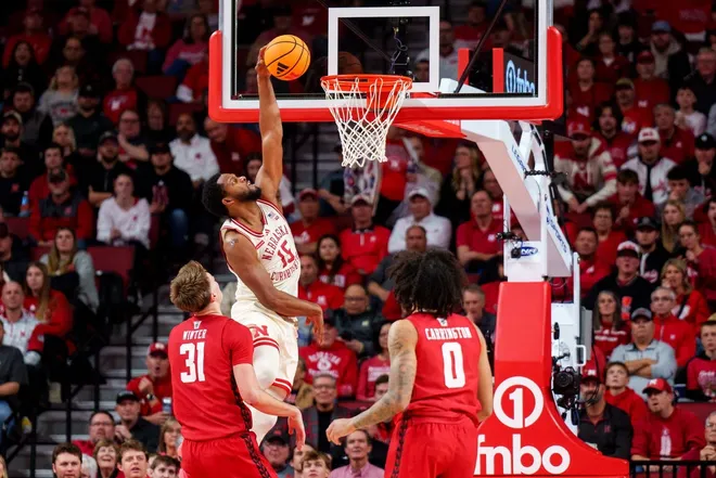 Dec 10, 2025; Lincoln, Nebraska, USA; Nebraska Cornhuskers forward Jared Garcia (15) shoots the ball against Wisconsin Badgers forward Nolan Winter (31) and forward Braeden Carrington (0) during the second half at Pinnacle Bank Arena.