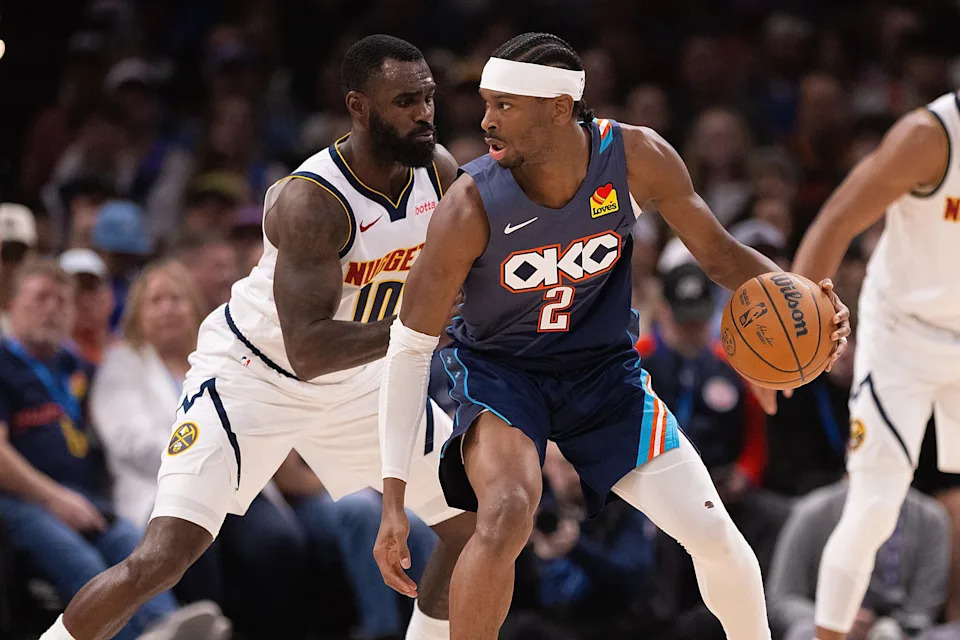 OKLAHOMA CITY, OKLAHOMA - FEBRUARY 27: Shai Gilgeous-Alexander #2 of the Oklahoma City Thunder handles the ball in front of Tim Hardaway Jr. #10 of the Denver Nuggets during the first half at Paycom Center on February 27, 2026 in Oklahoma City, Oklahoma. NOTE TO USER: User expressly acknowledges and agrees that, by downloading and or using this photograph, User is consenting to the terms and conditions of the Getty Images License Agreement. (Photo by Joshua Gateley/Getty Images)