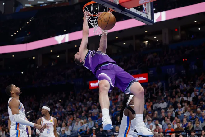 Jan 7, 2026; Oklahoma City, Oklahoma, USA; Utah Jazz guard/forward Svi Mykhailiuk (10) dunks against the Oklahoma City Thunder during the second half at Paycom Center. Mandatory Credit: Alonzo Adams-Imagn Images