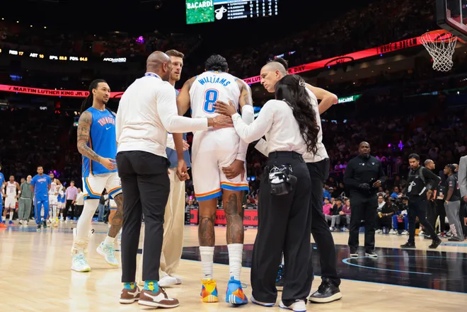 Jan 17, 2026; Miami, Florida, USA; Oklahoma City Thunder guard Jalen Williams (8) is helped off the court after a leg injury against the Miami Heat during the second quarter at Kaseya Center. Mandatory Credit: Sam Navarro-Imagn Images