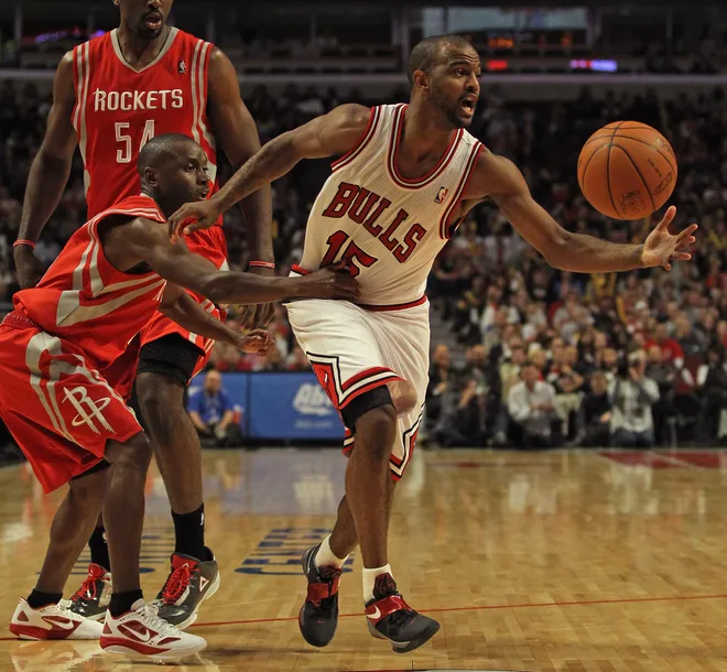 CHICAGO, IL - APRIL 02: Earl Boykins #6 of the Houston Rockets grabs John Lucas III #15 of the Chicago Bulls at the United Center on April 2, 2012 in Chicago, Illinois. The Rockets defeated the Bulls 99-93. NOTE TO USER: User expressly acknowledges and agrees that, by downloading and or using this photograph, User is consenting to the terms and conditions of the Getty Images License Agreement. (Photo by Jonathan Daniel/Getty Images)